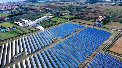 Airplane flying over a solar farm Airplane flying over a solar farm