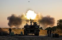 An Israeli artillery unit fires shells towards targets in Gaza Strip, at the Israeli Gaza border, Wednesday, May 19, 2021.