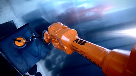 An ABB robot demonstrates it's automated building capabilities.