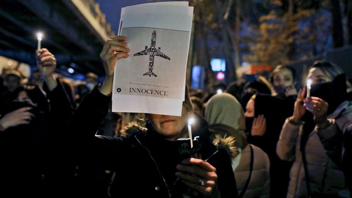 People in Tehran gather for a candlelit memorial for the plane crash victims in January 2020