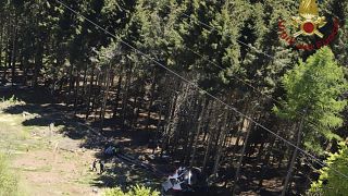 The wreckage of a cable car is seen on the ground after it collapsed near the summit of the Stresa-Mottarone line in the Piedmont region, northern Italy, May 23, 2022.