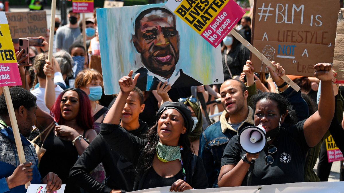 In this Saturday, June 13, 2020 file photo Sasha Johnson, center, of the Black Lives Matter movement attends a protest at Hyde Park in London.