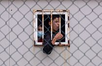 Children who crossed into Spain wait inside a temporary shelter in the enclave of Ceuta, next to the border of Morocco and Spain, Thursday, May 20, 2021.