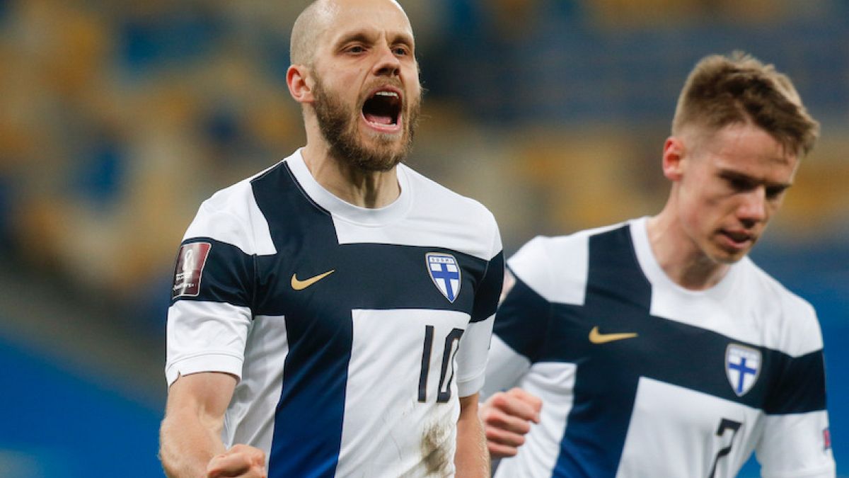 Finland's Teemu Pukki celebrates after scoring a penalty during the 2022 FIFA World Cup qualifying match against Ukraine.
