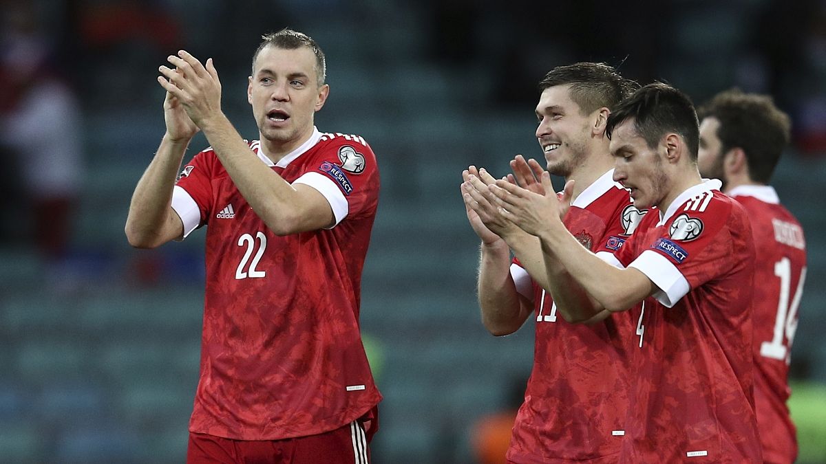 Russia's players celebrate after their FIFA 2022 World Cup qualifying match against Slovenia.