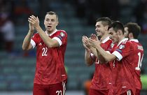 Russia's players celebrate after their FIFA 2022 World Cup qualifying match against Slovenia.