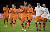 Netherlands' players cheer supporters at the end of their 2022 FIFA World Cup qualifying match against Latvia.
