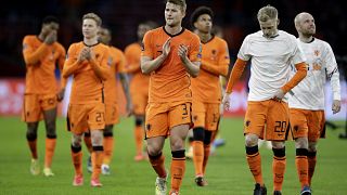 Netherlands' players cheer supporters at the end of their 2022 FIFA World Cup qualifying match against Latvia.