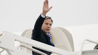 Secretary of State Antony Blinken waves as he departs, Monday, May 24, 2021, at Andrews Air Force Base, Md.