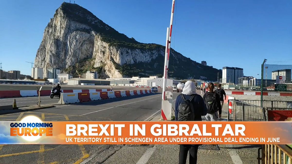 People walking across Gibraltar.  