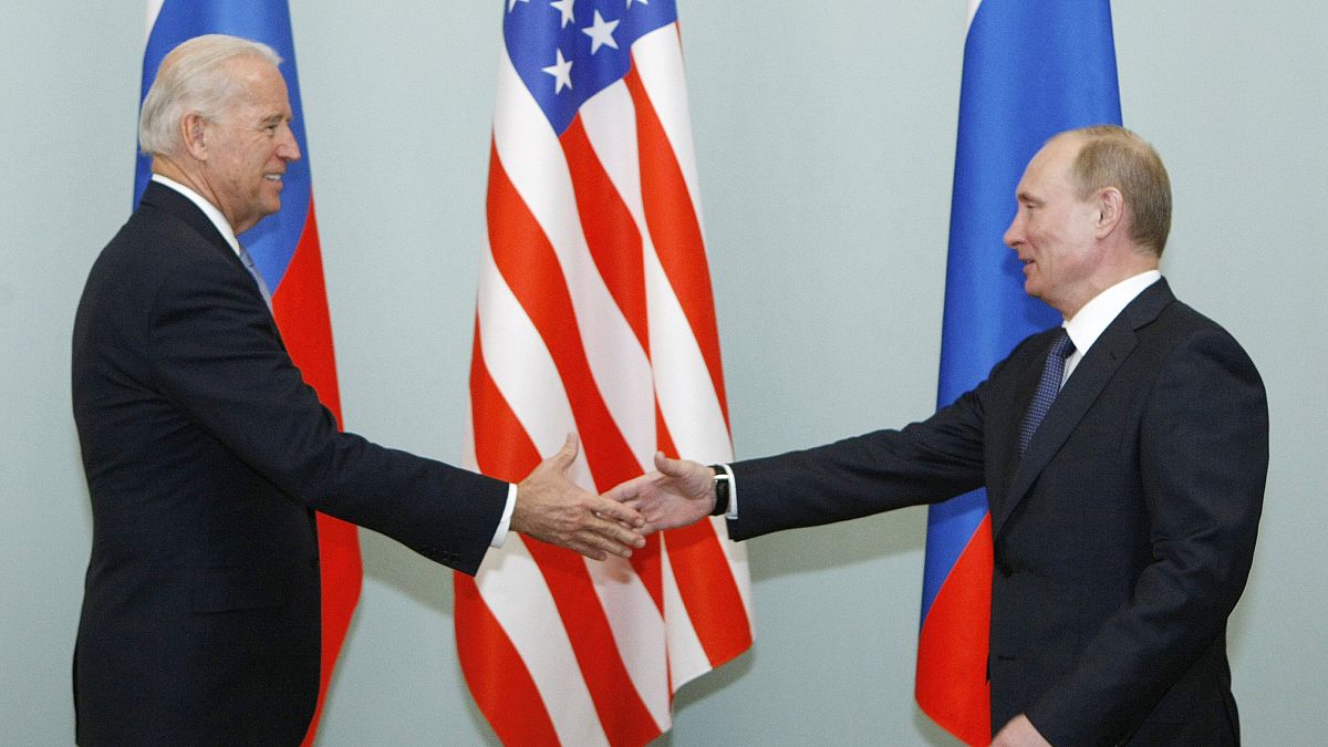 In this March 10, 2011, file photo, then Vice President Joe Biden, left, shakes hands with Russian Prime Minister Vladimir Putin in Moscow, Russia.