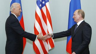 In this March 10, 2011, file photo, then Vice President Joe Biden, left, shakes hands with Russian Prime Minister Vladimir Putin in Moscow, Russia.