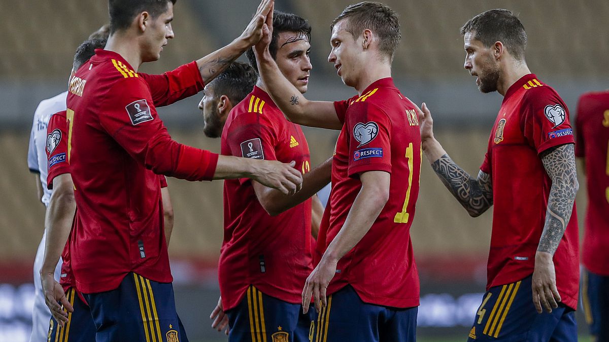 Spain players celebrate after scoring the opening goal during their 2022 FIFA World Cup qualifying match against Kosovo.