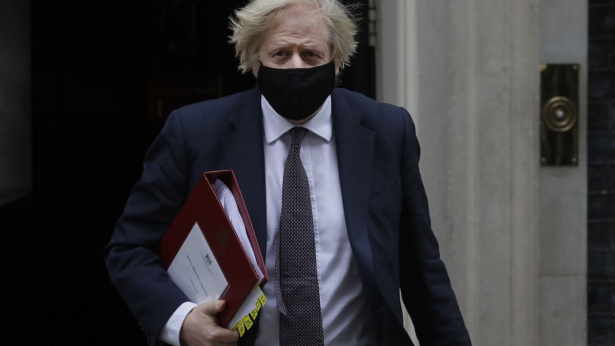 Britain's Prime Minister Boris Johnson leaves Downing Street to attend the weekly session of PMQs in Parliament in London, Wednesday, March 17, 2021.