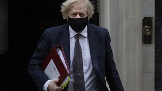 Britain's Prime Minister Boris Johnson leaves Downing Street to attend the weekly session of PMQs in Parliament in London, Wednesday, March 17, 2021.