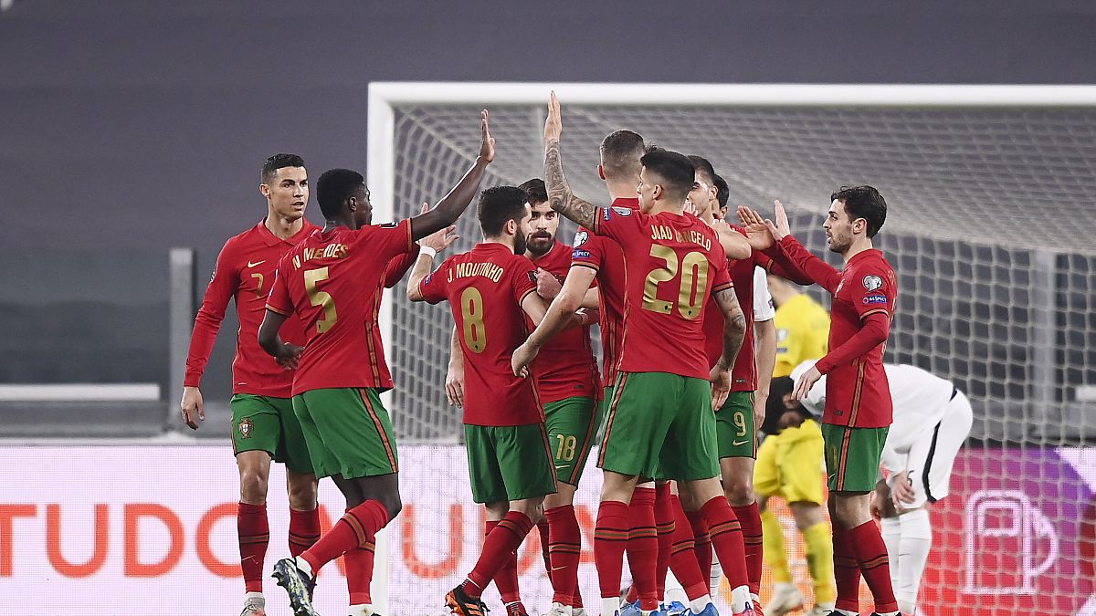 Portugal's players celebrate during their 2022 FIFA World Cup qualifying match against Azerbaijan.