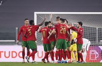 Portugal's players celebrate during their 2022 FIFA World Cup qualifying match against Azerbaijan.
