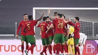 Portugal's players celebrate during their 2022 FIFA World Cup qualifying match against Azerbaijan.