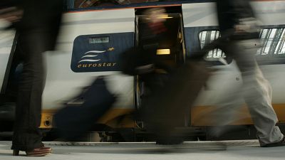 FILE: Travellers get off the first train into St Pancras International station in London, Wednesday Nov. 14, 2007.