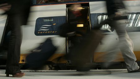 FILE: Travellers get off the first train into St Pancras International station in London, Wednesday Nov. 14, 2007.