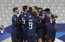 France's players celebrate their opening goal during the 2022 FIFA World Cup qualifying match against Ukraine.
