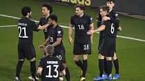 Germany's players celebrate during the 2022 FIFA World Cup qualifying match against Iceland.