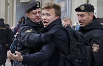 FILE - In this Sunday, March 26, 2017 file photo, Belarus police detain journalist Raman Pratasevich, center, in Minsk, Belarus.