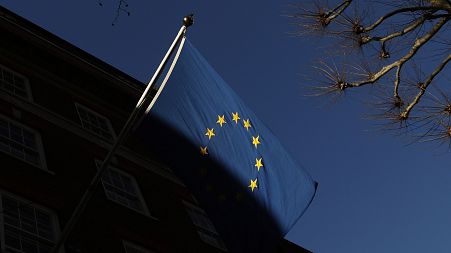 The European Union flag flies outside Europe House in London.