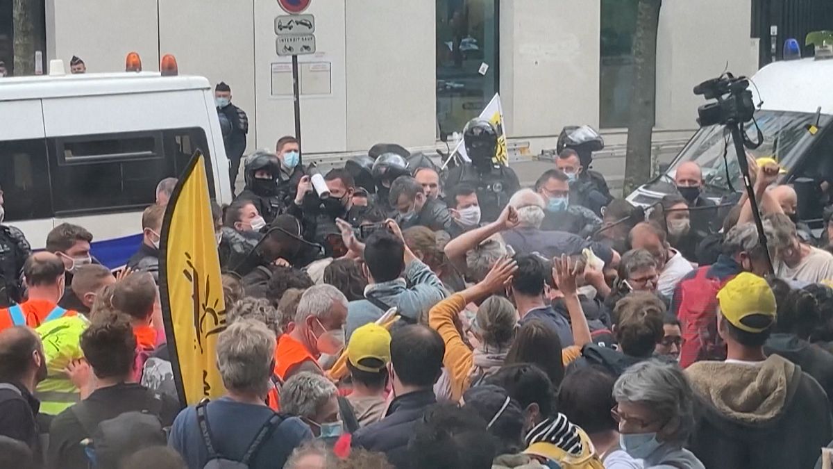 Protesters clash with police as they attempt to break up the protest