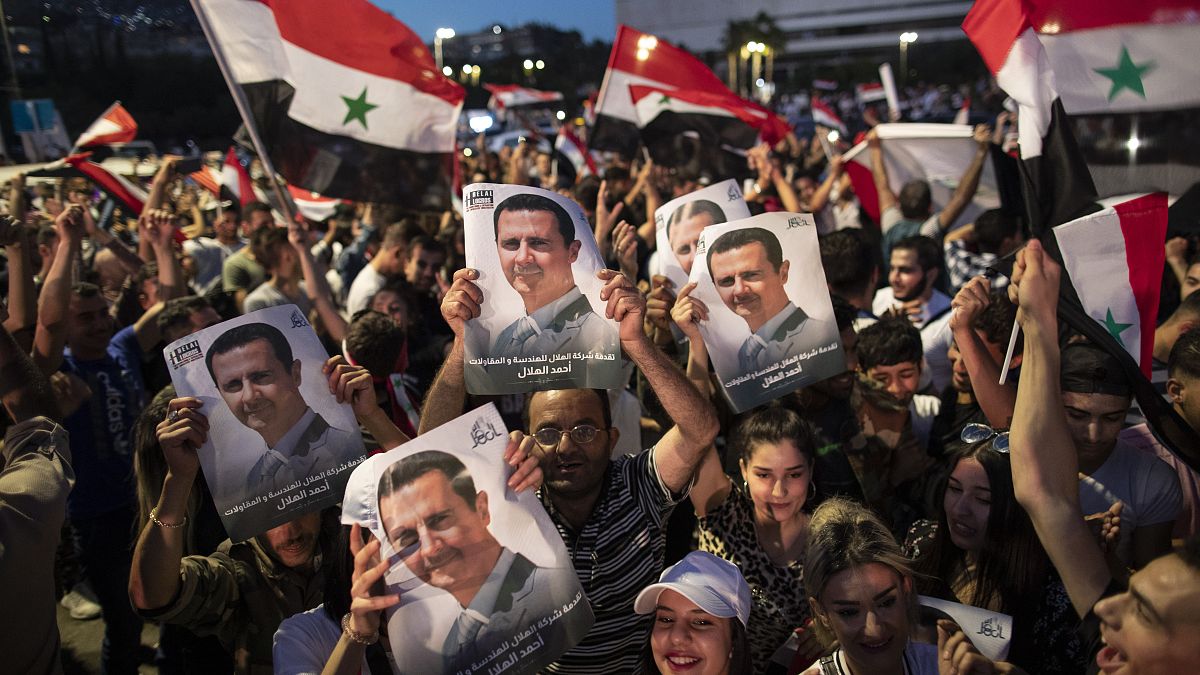 شاهد: احتفالات في مناطق سيطرة النظام السوري بفوز الأسد بولاية رئاسية جديدة