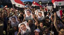 Simpatizantes de Bachar al Asad celebran el resultado en el centro de Damasco