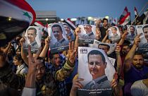 Crowds chanted: 'With our soul, blood, we defend you Bashar'