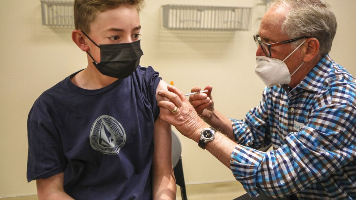 A 13 year-old child receives his first dose of the Pfizer-BioNTech vaccine on Thursday, May 13, 2021, after it was approved for use in the US for 12-15 year-olds.