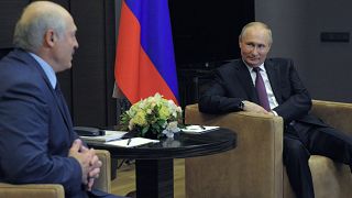 Russian President Vladimir Putin, right, listens to Belarusian President Alexander Lukashenko during a meeting in the Black Sea resort of Sochi, Russia, Friday, May 28, 2021.