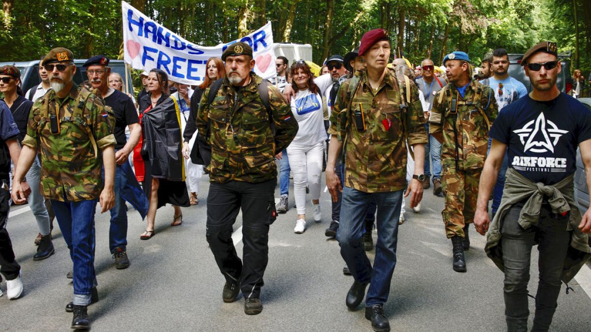 Protesters march from a Brussels park to the European Union headquarters on Saturday.
