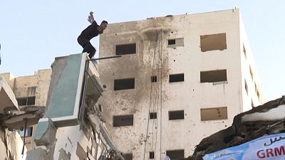 Palestinian youths practise parkour on rubble in Gaza
