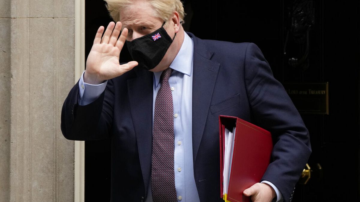 British Prime Minister Boris Johnson leaves 10 Downing Street to attend parliament in London on Wednesday