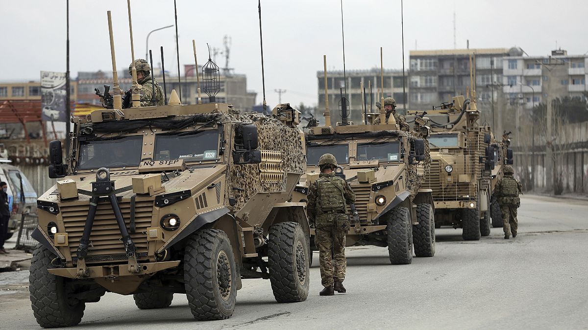 British soldiers with NATO-led Resolute Support Mission forces arrive at the site of an attack in Kabul, Afghanistan, March 25, 2020. 