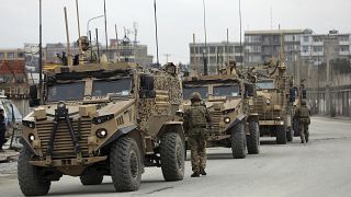 British soldiers with NATO-led Resolute Support Mission forces arrive at the site of an attack in Kabul, Afghanistan, March 25, 2020. 