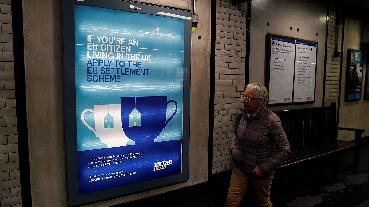 A poster encouraging EU nationals living in the UK to apply to the post-Brexit EU settlement scheme, at St James's Park underground station in London, March 25, 2019. 