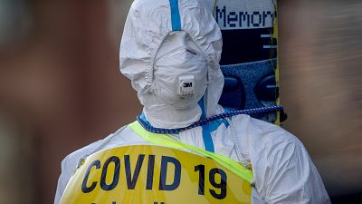 An advertising figure for Covid-19 rapid test stands in front of a small test center in Frankfurt, Germany on March 7, 2021. An advertising figure for Covid-19 rapid test stands in front of a small test center in Frankfurt, Germany on March 7, 2021.