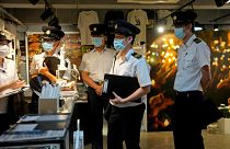 Police question staff at the June 4 Memorial Museum in Hong Kong