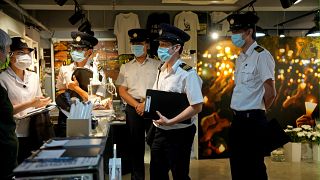 Police question staff at the June 4 Memorial Museum in Hong Kong