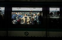 People commute in a metro in Paris