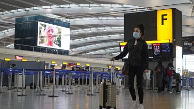 A passenger in the almost deserted departures hall at Terminal 5 of Heathrow Airport in west London on December 21, 2020. A passenger in the almost deserted departures hall at Terminal 5 of Heathrow Airport in west London on December 21, 2020.