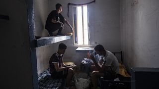 Migrants take shelter inside an abandoned building in the Spanish enclave of Ceuta
