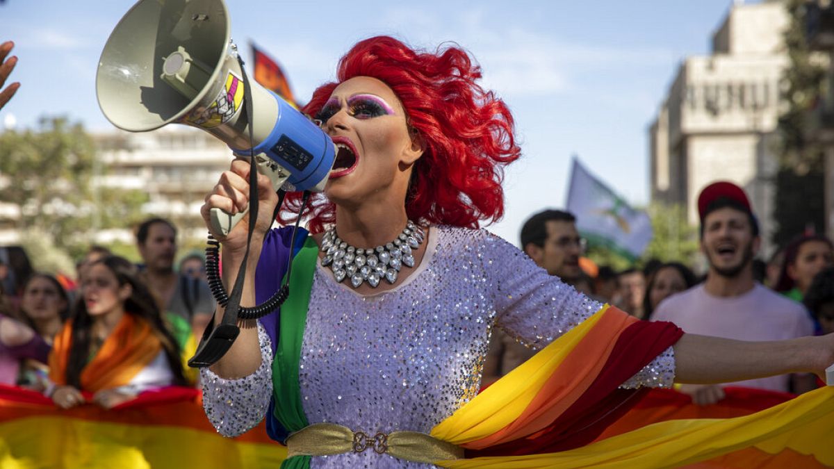 A participant dances in the annual Gay Pride parade in Jerusalem, Thursday, June 3, 2021.