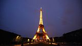 The Eiffel Tower is illuminated in Paris, Tuesday, May 25, 2021