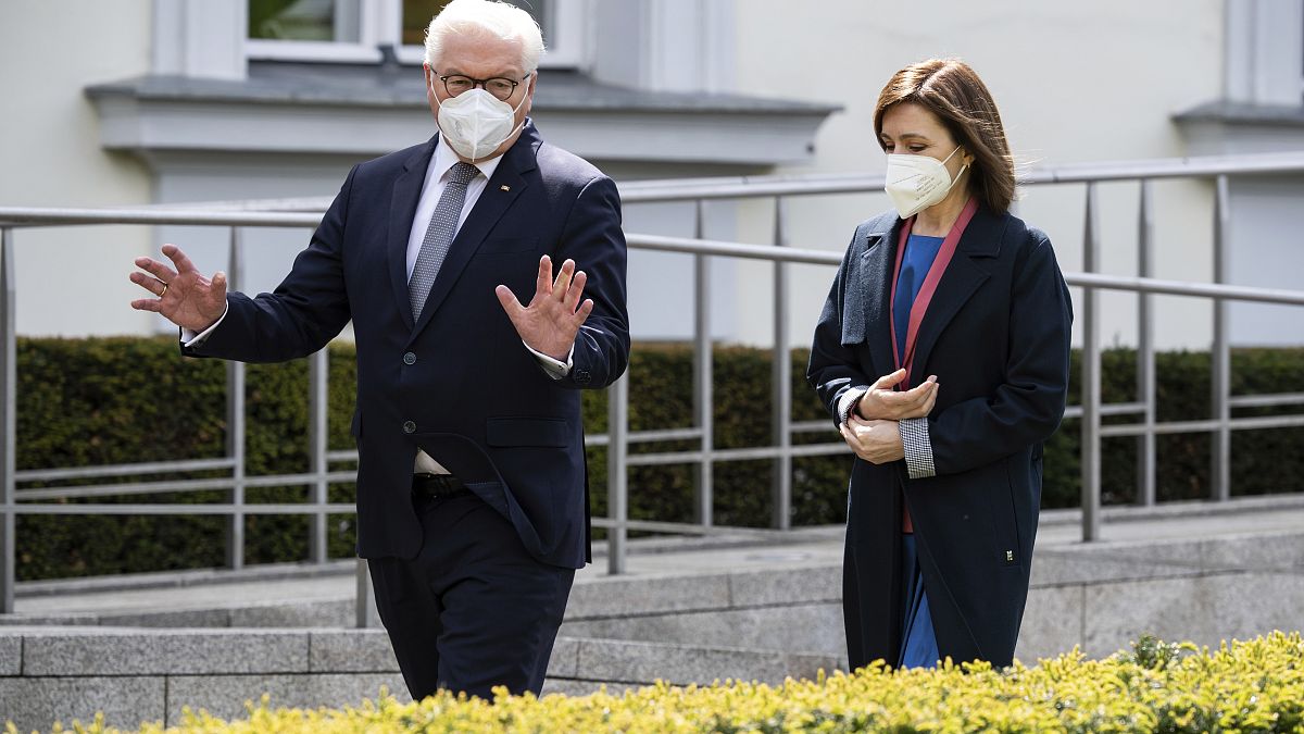 German President Frank-Walter Steinmeier and Maia Sandu, President of the Republic of Moldova, walk in the park of Bellevue Palace before a meeting in Berlin. 