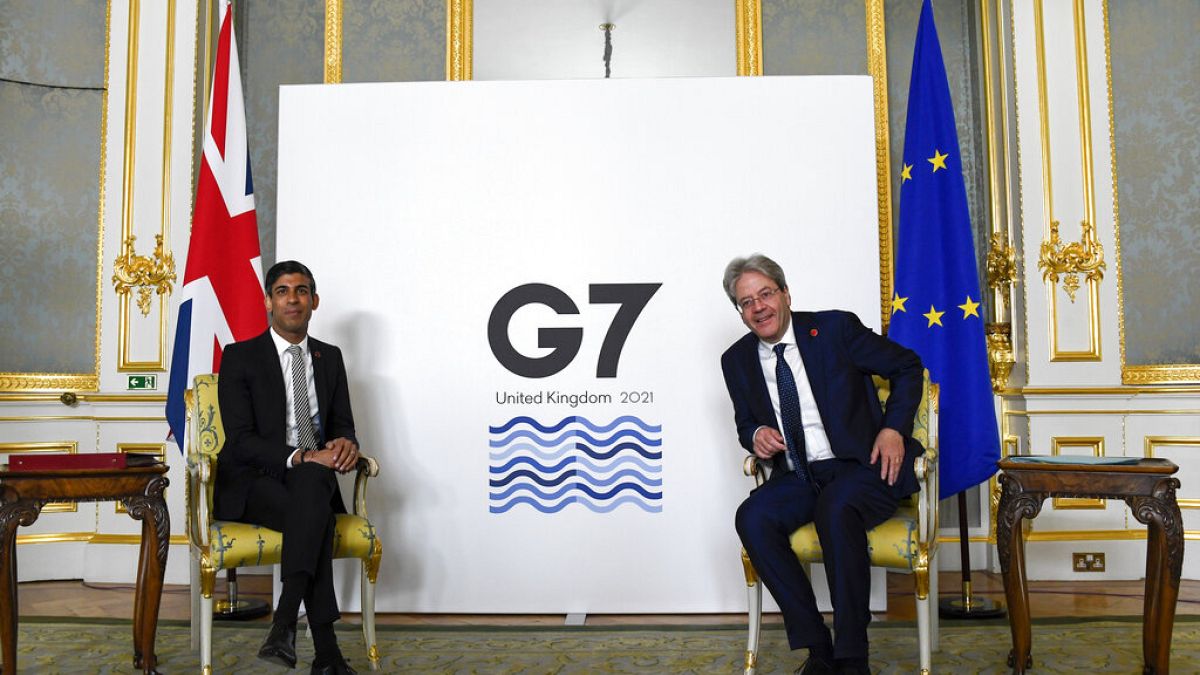 Britain's Chancellor of the Exchequer Rishi Sunak, left, and EU's Economy Commissioner Paolo Gentiloni pose for photos at the G7 summit